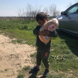 Child Holding Bread