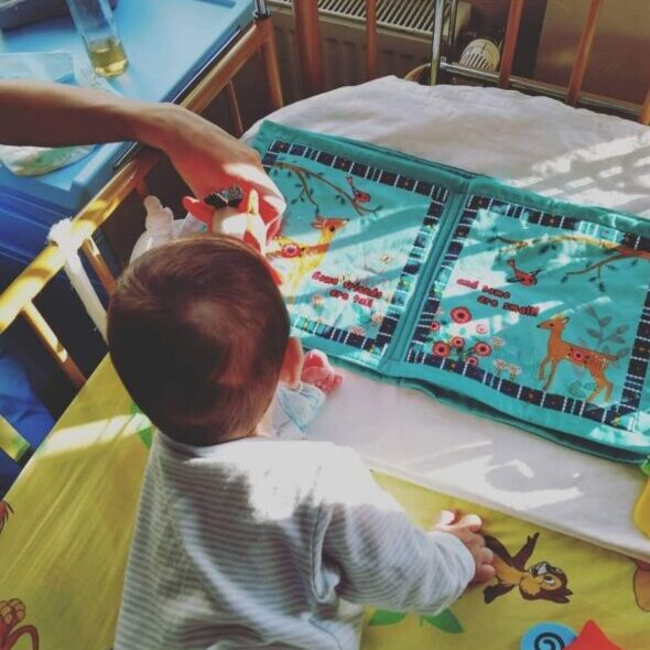 a baby crawling in crib